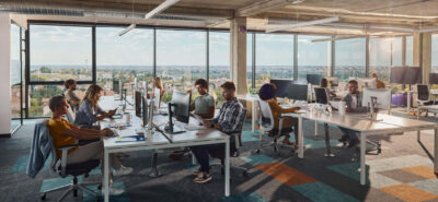 a group of employees working in a bright office in Toronto