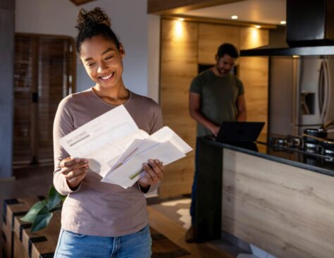 couple opening a letter of sponsorship approval